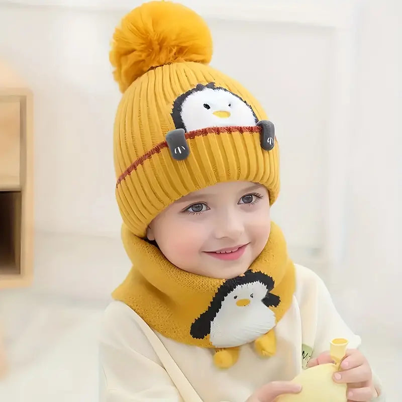 Bonnet écharpe motif pingouin.